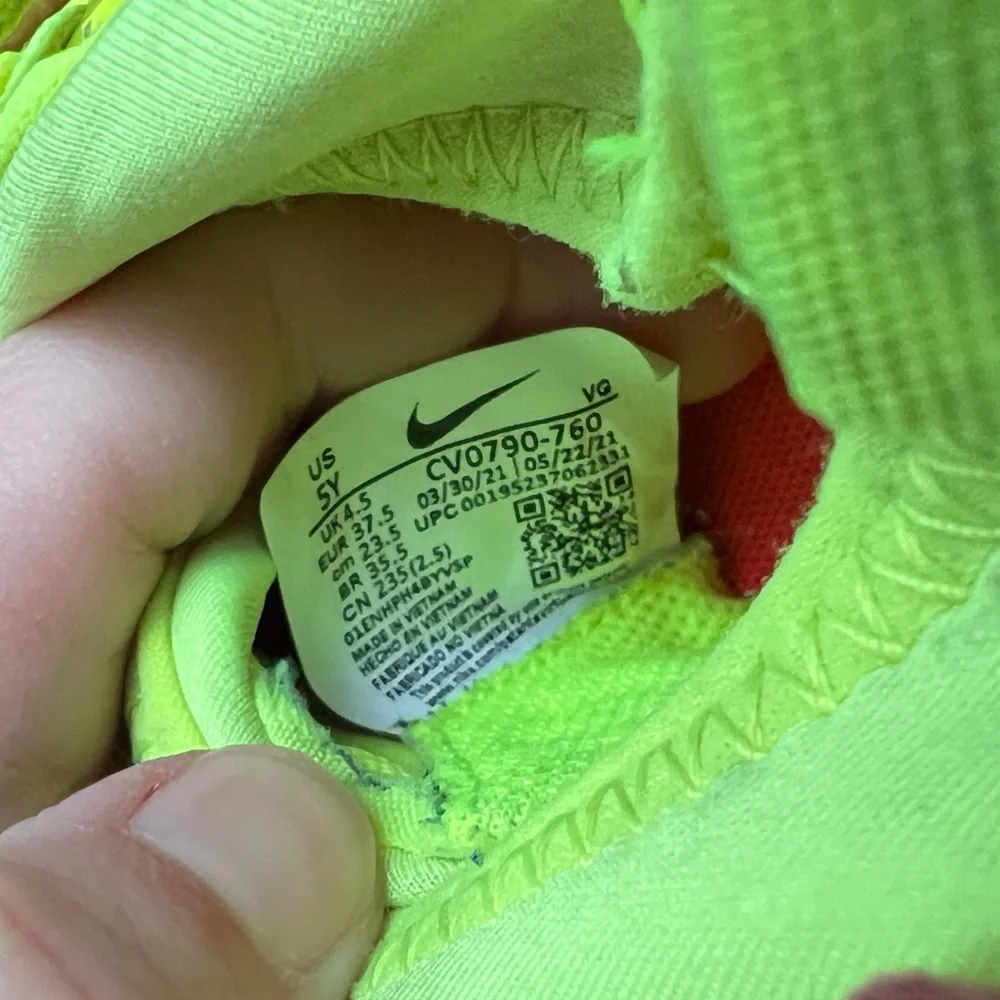 Neon yellow soccer cleats